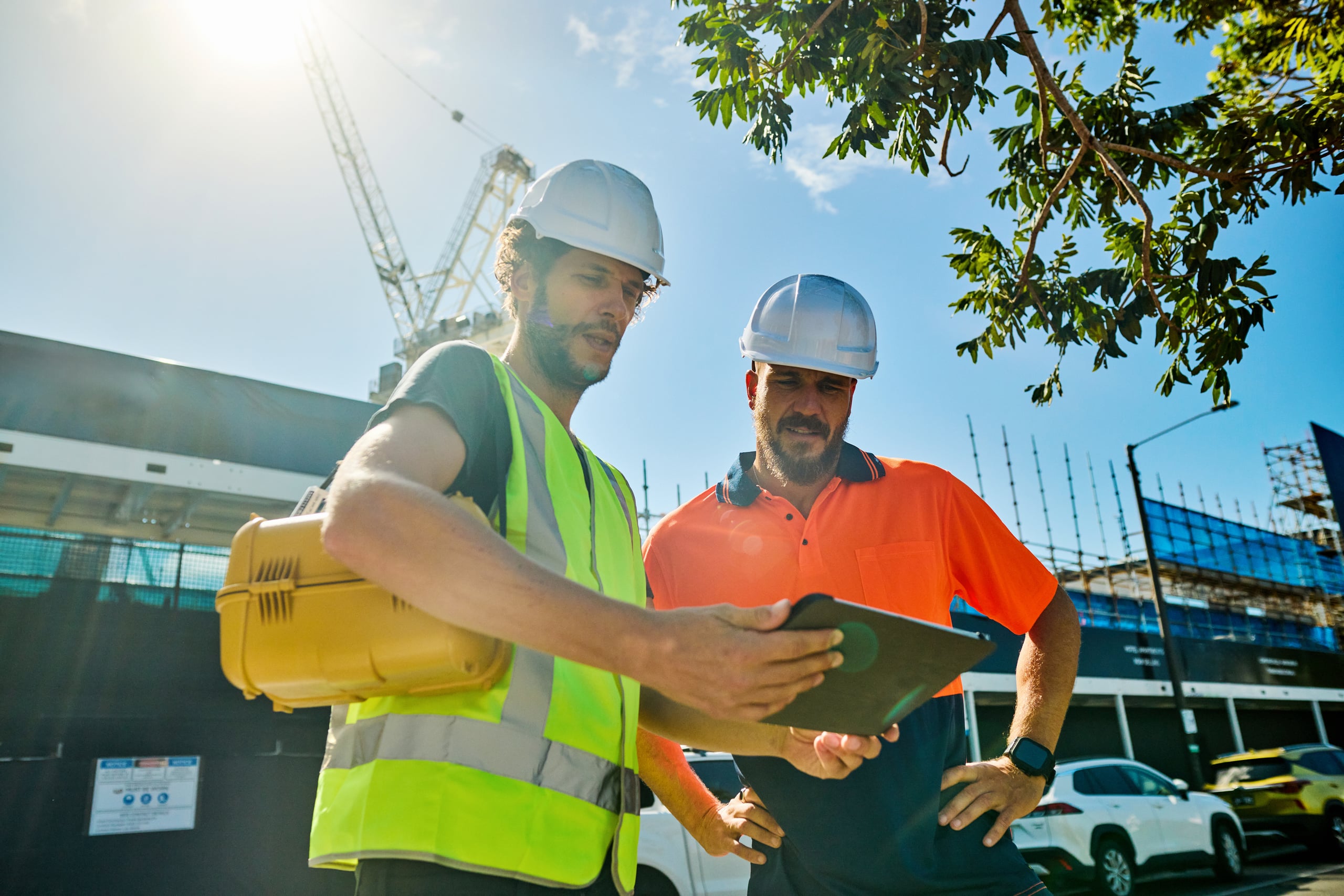 Field technicians reviewing work on a job site
